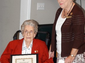 Wallaceburg's Doris Hall, left, is honoured for her long-time service Order of the Eastern Star. Hall joined the fraternal organization in 1939. Presenting her with a certificate is Shirley Lamond.
