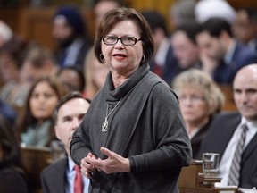Public Services and Procurement Minister Judy Foote answers a question during Question Period in the House of Commons in Ottawa on Feb.23, 2017. Foote announced her resignation from the federal cabinet due to family reasons. (Adrian Wyld/The Canadian Press/Files)