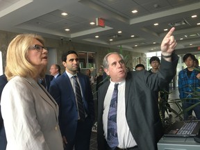 Cytognomix president Dr. Peter Rogan shows automatic chromosome radiation testing software to London West MP Kate Young and London North Centre MP Peter Fragiskatos. The London company is the recipient of $263,713 from the federal government's Build In Canada Innovation Program. (JENNIFER BIEMAN, The London Free Press)