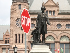 A statute of Sir John A. MacDonald is located at the bottom of Queen's Park Circle at the foot of the Ontario Legislature lawn on Thursday August 24, 2017. (Jack Boland/Toronto Sun)