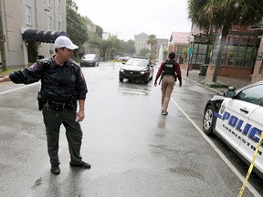 Charleston, S.C., Police Department blocks the street during an active hostage situation in the city on Thursday, Aug. 24, 2017. (AP Photo/Mic Smith)