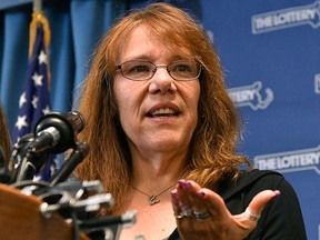 Mavis Wanczyk, of Chicopee, Mass., speaks during a news conference where she claimed the US$758.7 million Powerball prize at Massachusetts State Lottery headquarters, Thursday, Aug. 24, 2017, in Braintree, Mass. Officials said it is the largest single-ticket Powerball prize in U.S. history. (AP Photo/Josh Reynolds)