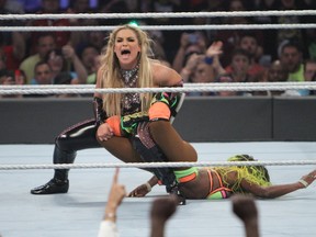World Wrestling Entertainment superstar and Calgary native Natalya wins her first WWE women's championship by forcing her opponent, Naomi, to submit to the Sharpshooter at SummerSlam in Brooklyn, N.Y., on Sunday. (George Tahinos/SLAM! Wrestling)