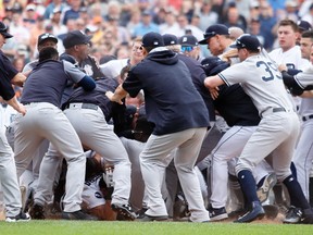 Detroit Tigers' Miguel Cabrera is in the bottom of the pile as the New York Yankees fight with the Detroit Tigers during an MLB game on Aug. 24, 2017, in Detroit. (AP Photo/Duane Burleson)