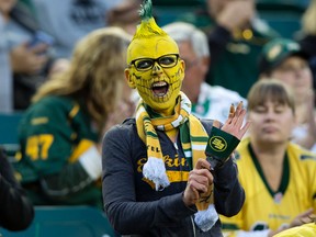 The Edmonton Eskimos' fan cheers on the team against the Saskatchewan Roughriders at Commonwealth Stadium, in Edmonton on Friday Aug. 26, 2016.