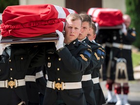 Representatives from the Government of Canada and the Canadian Armed Forces attended a military burial for Private Reginald Joseph Winfield Johnston and Sergeant. Harold Wilfred Shaughnessy at Loos British Cemetery in Loos-en-Gohelle, France on Thursday, August 24, 2017 in this handout photo. (THE CANADIAN PRESS/HO, Sgt Adam Orton, Canadian Army)