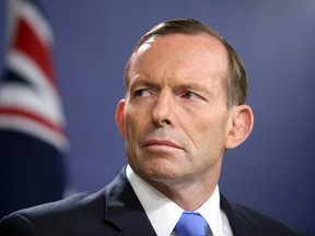 In this Sept. 19, 2014 file photo, Australian Prime Minister Tony Abbott speaks during a press conference in Sydney. (AP Photo/Rick Rycroft, File)