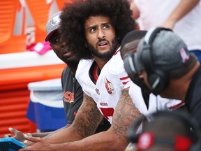 Colin Kaepernick of the San Francisco 49ers sits on the bench during an NFL game against the Buffalo Bills at New Era Field on Oct. 16, 2016 in Buffalo, New York. (Tom Szczerbowski/Getty Images)
