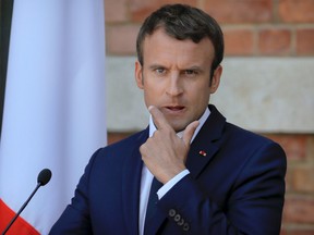 French President Emmanuel Macron gestures during a press conference with his Bulgarian counterpart Rumen Radev at the Euxinograd residence outside Varna, Bulgaria, Friday, Aug. 25, 2017. (AP Photo/Vadim Ghirda)