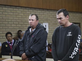 Theo Jackson (left) and Willem Oosthuizen (right) appear in the Magistrates Court in Middelburg, South Africa, on Nov. 16, 2016. The two men have been convicted Friday, Aug. 25, 2017, of attempted murder, kidnapping and other charges. (AP Photo/Files)
