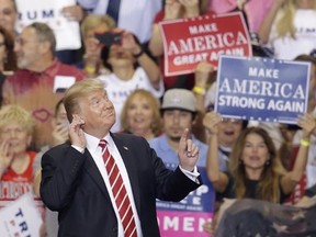 U.S. President Donald Trump gestures to the crowd while speaking at a rally at the Phoenix Convention Center, Tuesday, Aug. 22, 2017, in Phoenix. (AP Photo/Rick Scuteri)