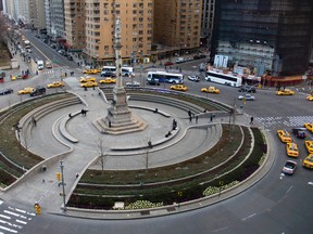 In this Jan. 13, 2008 file photo, traffic goes around New York's Columbus Circle and its 70-foot-tall column topped by a statue of Christopher Columbus. (AP Photo/Cameron Bloch, File)
