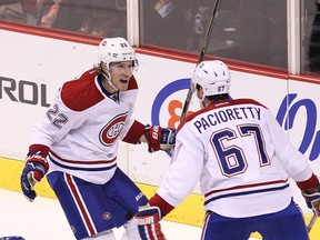 Montreal Canadiens Dale Weise (left) congratulates teammate Max Pacioretty (right) on his goal against the Vancouver Canucks during the third period of NHL game at Rogers Arena in Vancouver, B.C. on Thursday October 30, 2014. Weise was signed as a free agent last summer by the Philadelphia Flyers. Postmedia files