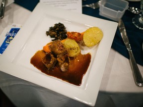 The main course served at the recent UnWasted Dinner, a fundraiser for Loving Spoonful. The main course was composed Burgundy beef stew with wild mushroom duxelles, sous vide duck fat potatoes, roasted carrots and oven-roasted tomatoes. (Viara Mileva photo)
