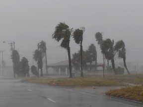 Strong winds batter a house on Padre Island before the approaching Hurricane Harvey in Corpus Christi, Texas on August 25, 2017. Hurricane Harvey will soon hit the Texas coast with forecasters saying it is possible expect up to 3 feet of rain and 125 mph winds.(MARK RALSTON/AFP/Getty Images)