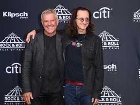 Inductees Alex Lifeson (L) and Geddy Lee of RUSH pose at the 31st Annual Rock And Roll Hall of Fame Induction Ceremony at Barclays Center on April 7, 2017 in New York City.(ANGELA WEISS/AFP/Getty Images)