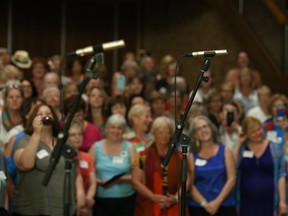 Georgette Fry, right, with the Shout Sister! Choir on Aug. 19 in Belleville. (Tim Miller/Postmedia Network)