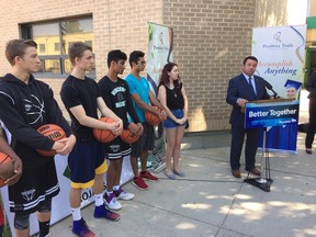 Municipal Relations Minister Jeff Wharton announces funding for public school infrastructure outside Vincent Massey Collegiate in Winnipeg on Friday, Aug. 25, 2017, as students stand by. JASON FRIESEN/Winnipeg Sun/Postmedia Network