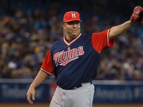 Minnesota Twins starting pitcher Bartolo Colon acknowledges the crowd as he is pulled from the game during seventh inning Major League baseball action against the Toronto Blue Jays in Toronto on Aug. 25, 2017. (THE CANADIAN PRESS/Chris Young)