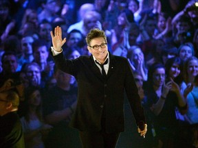 k.d. lang waves to the crowd after receiving a Juno for her Canadian Music Hall of Fame induction during the 2013 Juno Awards in Regina on Sunday, April 21, 2013. Four-time Grammy winner k.d. lang will mark the success of her 1992 hit single "Constant Craving" and its album "Ingenue" with a 17-city Canadian tour which includes a stop in Winnipeg. THE CANADIAN PRESS/Liam Richards