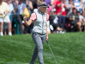 Canada's Brooke Henderson pumps her fist after sinking a putt on the 18th hole during third round play at the Canadian Pacific Women's Open in Ottawa, Saturday Aug. 26, 2017. THE CANADIAN PRESS/Adrian Wyld