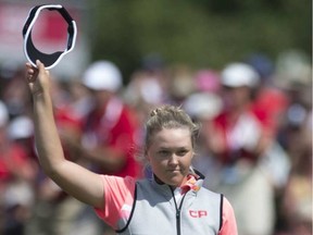 Canada's Brooke Henderson acknowledges the gallery after sinking a putt on the 18th green during third round play at the Canadian Pacific Women's Open in Ottawa, Saturday August 26, 2017.