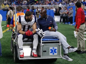 New England Patriots wide receiver Julian Edelman (11) is taken off the field on a cart during the first half of an NFL preseason football game against the Detroit Lions, Friday, Aug. 25, 2017, in Detroit. (AP Photo/Duane Burleson)