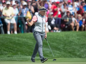 Canada's Brooke Henderson pumps her fist after sinking a putt on the 18th hole during third round play at the Canadian Pacific Women's Open in Ottawa, Saturday August 26, 2017. (THE CANADIAN PRESS/Adrian Wyld)