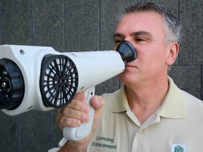 Orest Katolyk, head of bylaw enforcement for the City of London, demonstrates an odour detection device called the Nasal Ranger Field Olfactometer which his department is testing. Photo taken on Friday August 25, 2017. (MORRIS LAMONT, The London Free Press)