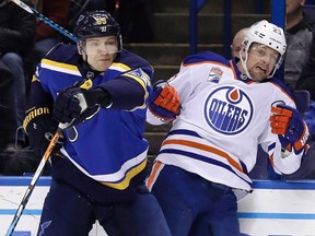 St. Louis Blues' Colton Parayko, left, collides with Edmonton Oilers' Matt Hendricks along the boards during the first period of an NHL hockey game, Monday, Dec. 19, 2016, in St. Louis. The Winnipeg Jets signed forward Hendricks to a one-year contract on Saturday. The deal is worth $700,000.THE CANADIAN PRESS/AP/Jeff Roberson