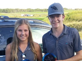 Cassidy Laidlaw and Reid Woodman show off their hardware after winning the titles at the 2016 McLennan Ross Junior Golf Tour Championship at Wolf Creek Resort. The 2017 Tour Championship takes place at Wolf Creek on Monday, Aug. 28. Kaitlyn Wingean and Austin Noskiye are among the favourites to with the event this year.