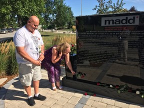 Kelly and Leah Fright stand by the Manitoba Memorial Monument on Sunday, Aug. 27, 2017 at the Glen Eden Funeral Home and Cemetery in West St. Paul, Man., near Winnipeg to honour their daughter Shea who died in a collision with a drunk driver in June 2016. MADD Manitoba chapters and community leaders gathered with families and friends of those killed as a result of impaired driving to add six more names to the Manitoba Memorial Monument. JASON FRIESEN/Winnipeg Sun/Postmedia Network