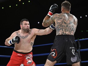 Adam Braidwood (right) fighting Tim Hague during the KO 79 boxing event at the Shaw Centre in Edmonton, June 16, 2017.
