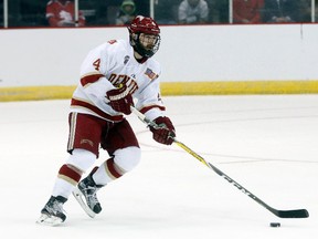In this March 25, 2017, file photo, University of Denver’s Will Butcher skates up the ice in the regional semifinals of the NCAA tournament against Michigan Tech, in Cincinnati. (AP Photo/John Minchillo, File)