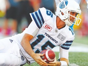 Argonauts quarterback Ricky Ray checks for the first-down marker after being tackled by the Stampeders defence on Saturday night in Calgary. (Al Charest, Postmedia)