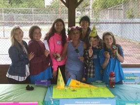 Selling  at the Friday Gore Bay Outdoor Market, the Youth Enterprise Camp Headstart in Business, led by Kelly Mazzetti and Jennifer Marenger, with amazing students Willow Fogel, Jack Young, Cara Nahwegahbow  and Ella Corbiere, stand with  our Bonnie, who bought everything they were selling.