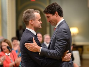 Prime Minister Justin Trudeau congratulates new veterans Affairs Minister Seamus O'Regan at a swearing-in ceremony at Rideau Hall in Ottawa on Monday, Aug. 28, 2017. THE CANADIAN PRESS/Adrian Wyld