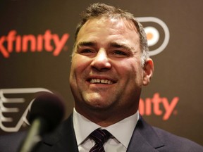 In this Nov. 20, 2014, file photo, former Philadelphia Flyers' Eric Lindros laughs while answering a question during a news conference before an NHL hockey game against the Minnesota Wild in Philadelphia. (AP Photo/Matt Slocum, File)
