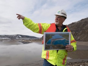 Bob Peever, of B.C. Hydro, gives a site tour of the Site C Dam location that runs along the Peace River in Fort St. John, B.C. on April 18, 2017. THE CANADIAN PRESS/Jonathan Hayward
