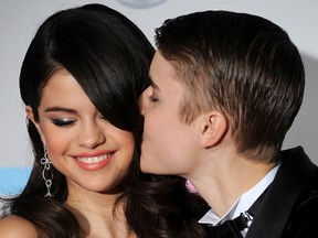 Singers Selena Gomez and Justin Bieber arrive at the American Music Awards, in Los Angeles, California, on November 20, 2011. (VALERIE MACON/AFP/Getty Images)