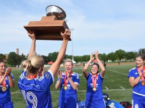 London Marconi Azzurri players celebrate with the Ontario masters trophy after winning it for a third straight year on the weekend.