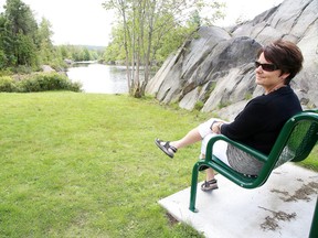 Lee Ann Ducharme relaxes during her lunch hour in a small park next to the beach area in Capreo on Monday August 28, 2017. Capreol has received $1.8 million to beautify the town.Gino Donato/Sudbury Star/Postmedia Network