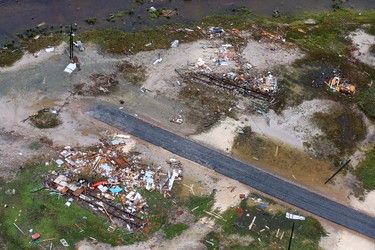 This aerial photo shows a view of damage in the wake of Hurricane Harvey, Monday, Aug. 28, 2017, in Corpus Christi, Texas. Harvey hit the coast as a Category 4 hurricane. (Gabe Hernandez/Corpus Christi Caller-Times via AP) ORG XMIT: TXCOR209