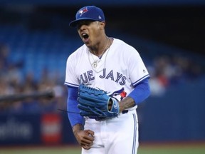 Marcus Stroman of the Toronto Blue Jays reacts after a throwing error by Raffy Lopez allowed an unearned run in the second inning during MLB game action against the Boston Red Sox at Rogers Centre on August 28, 2017 in Toronto. (Tom Szczerbowski/Getty Images)