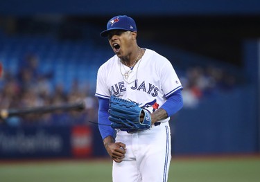 Marcus Stroman #6 of the Toronto Blue Jays reacts after a throwing error by Raffy Lopez #1 allowed an unearned run in the second inning during MLB game action against the Boston Red Sox at Rogers Centre on August 28, 2017 in Toronto, Canada. (Photo by Tom Szczerbowski/Getty Images)