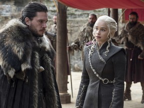 This image released by HBO shows Kit Harington, left, and Emilia Clarke on the season finale of "Game of Thrones." The series set yet another audience record Sunday with its seventh-season finale. Nielsen says an all-time high of 12.1 million viewers were tuned in to the wildly popular fantasy drama. An additional 4 million caught the episode on streaming channels. (Macall B. Polay/HBO via AP)