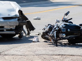 Tim Miller/Intelligencer File Photo
Jay Wannamaker's motorcycle lays in the road after a collision with an oncoming car on Cannifton Road North on Friday, July 10, 2015 in Belleville.