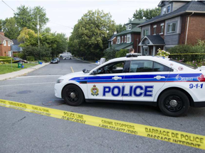 Ottawa Police investigate the scene of a shooting on Blackburn Ave between Templeton St. and Somerset St. East where they found one man with injuries around 2 a.m. Tuesday, August 29, 2017. (Darren Brown, Postmedia)