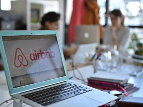This file photo taken on April 21, 2015 shows the logo of online lodging service Airbnb displayed on a computer screen in the Airbnb offices in Paris on April 21, 2015. (Martin Bureau/Getty Images)