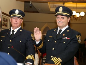 Jason Miller/The Intelligencer
Mayor Taso Christopher oversees the swearing in ceremony for newly hired deputy fire chiefs Paul Patry (left), who will serve as deputy chief of administration and Don Corbett, deputy chief of operations.